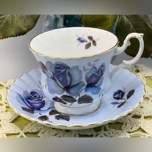 Royal Albert light blue teacup and saucer with blue roses